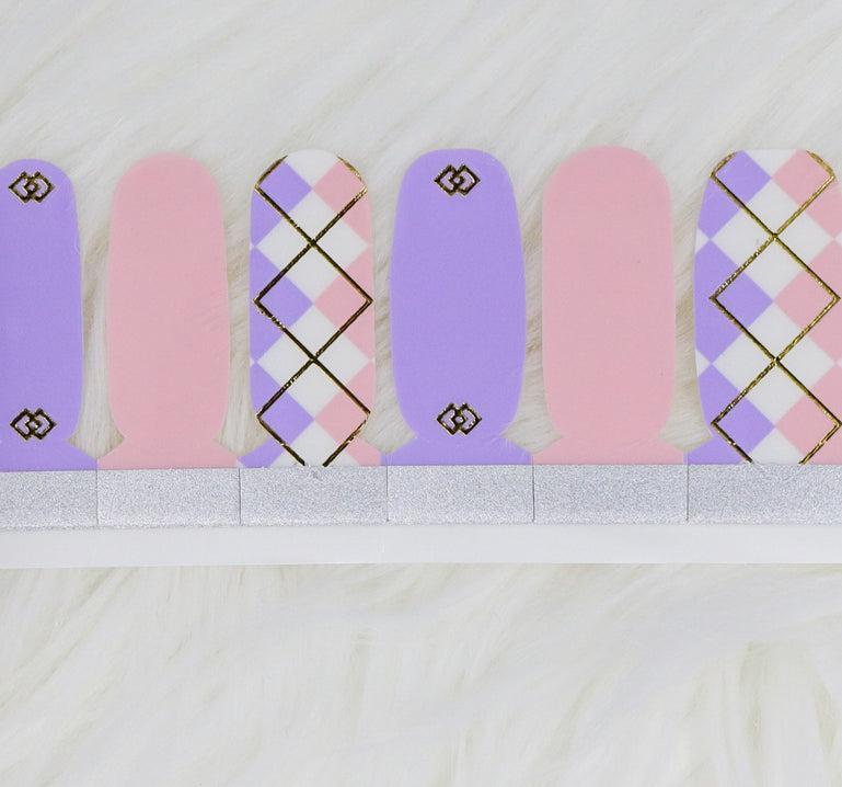 Pastel pink and purple nail wraps with accent argyle design.